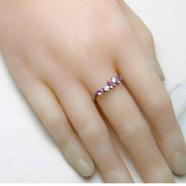 Pear pink sapphire ring on hand